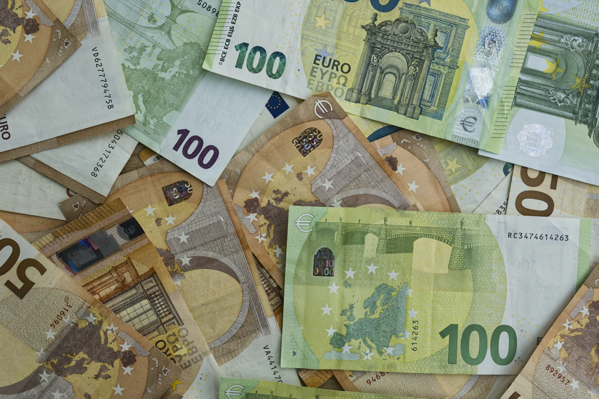 Euro banknotes - 100 and 50 euro notes spread on a table