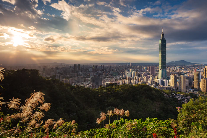 Taipei - Taipei 101 above a city of night markets
